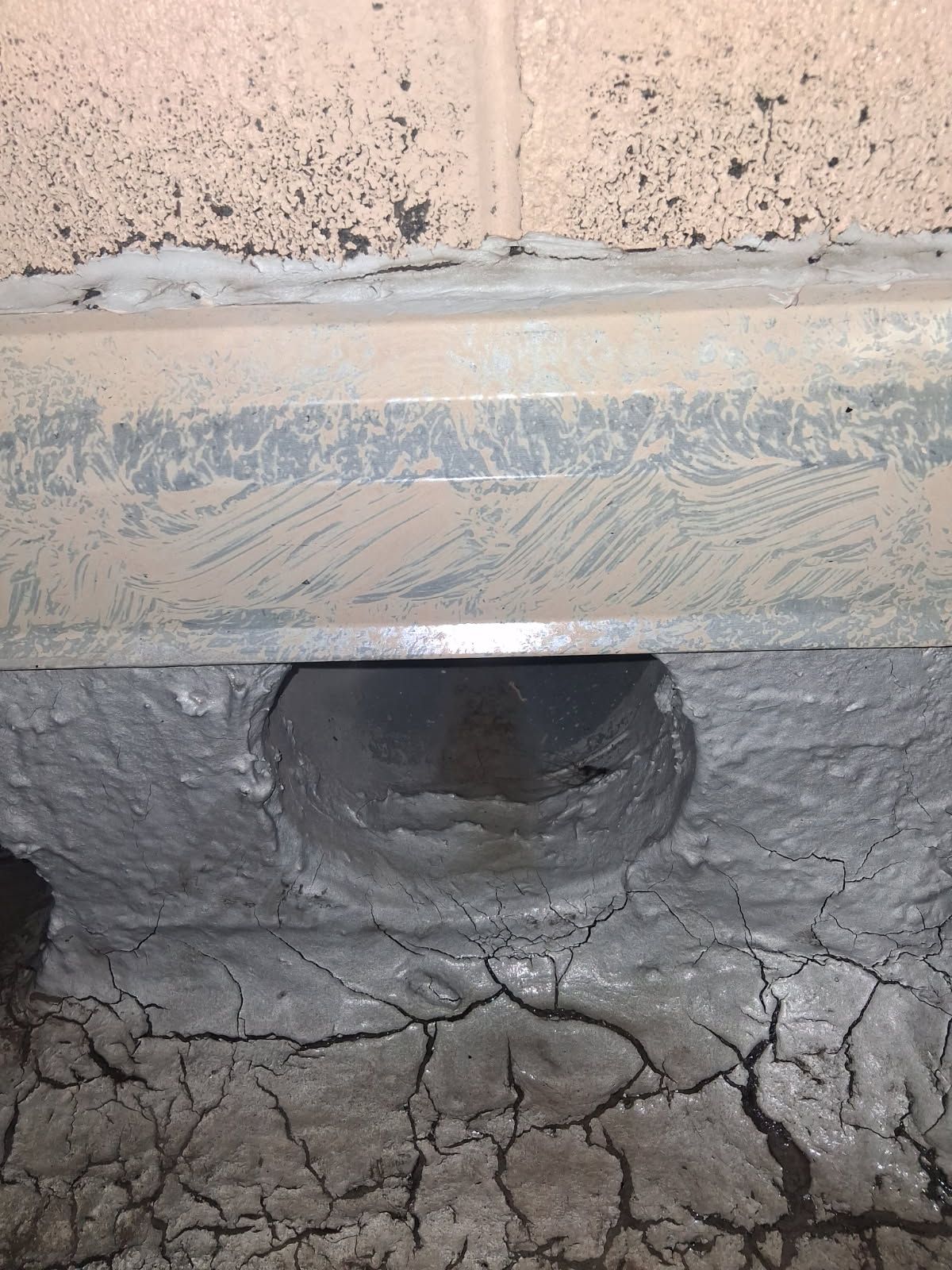 The same scupper opening clear, with the roof surface drained